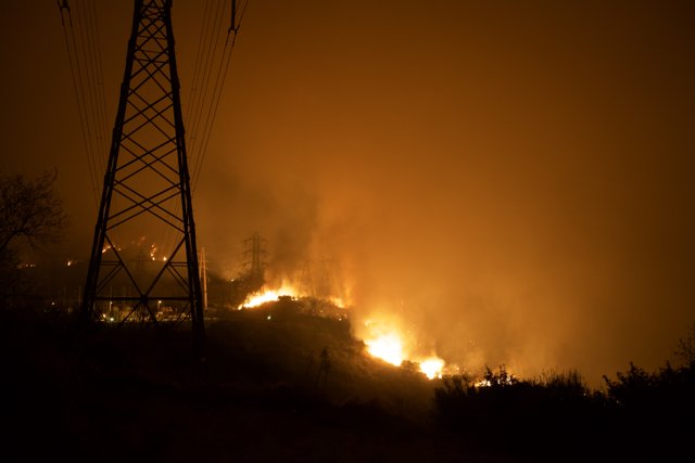 Burning Hillside Near Power Lines