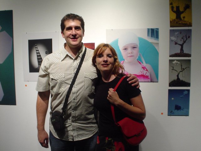 Couple Posing Together at Art Gallery Opening