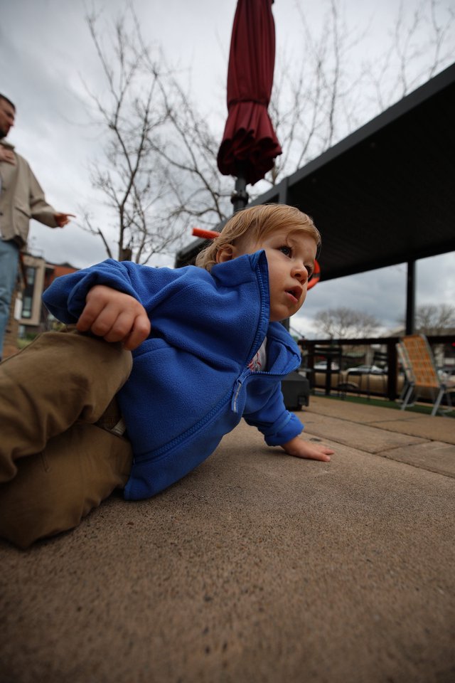 Young Child Playing on Outdoor Patio in Winter