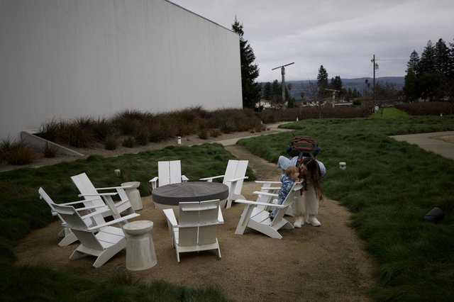 Mother and Child Moment at Modern Winery Firepit