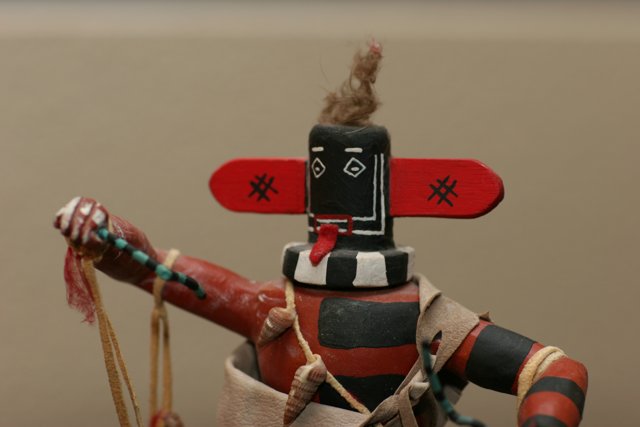 Tiny Native American Doll with a Red Hat
