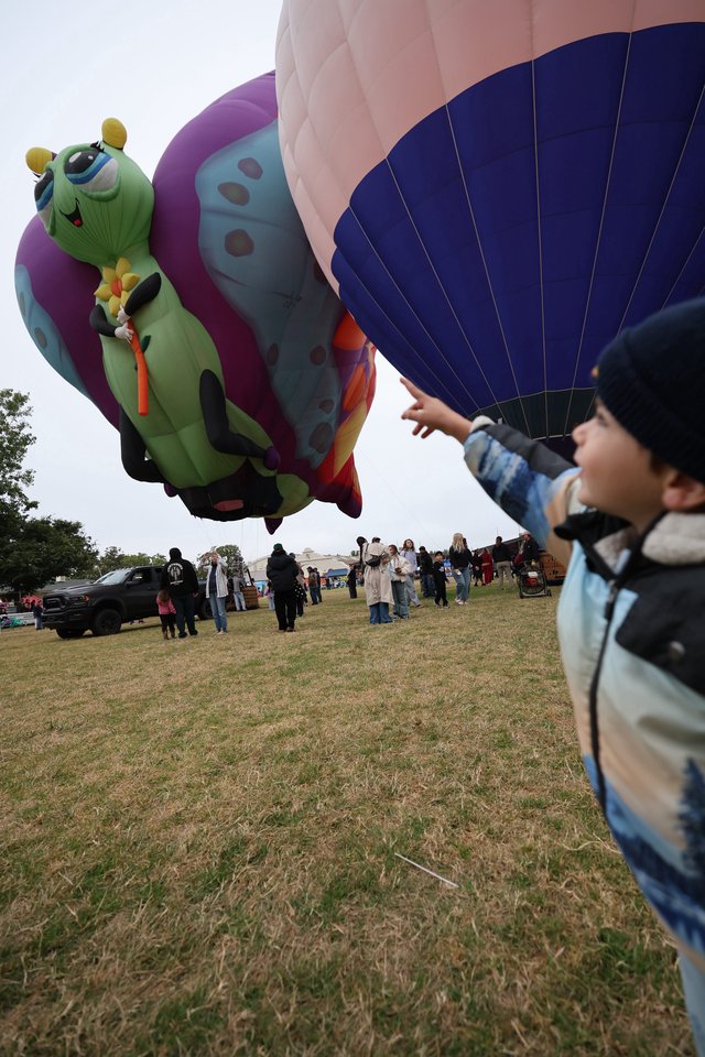 Child's Wonder at Hot Air Balloon Festival Launch