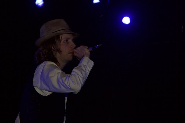 Beck Performs Solo Set in Fedora and Vest