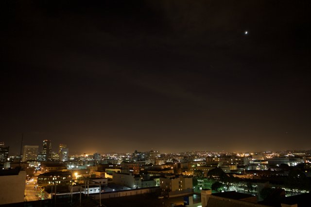 City Metropolis illuminated by Lunar Eclipse