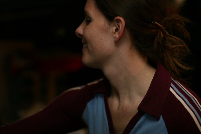 Candid Profile Portrait of a Smiling Young Woman