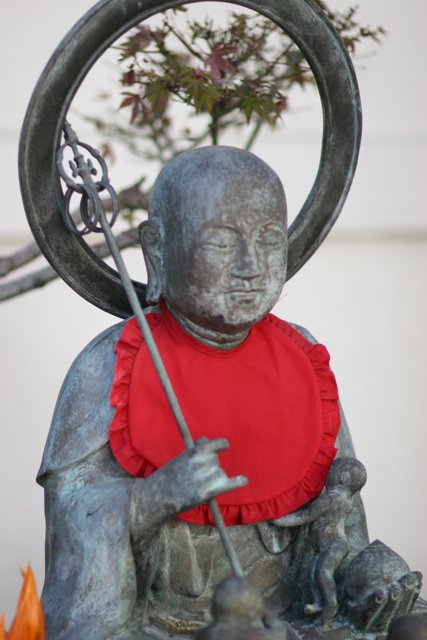 Serene Buddha with Red Scarf