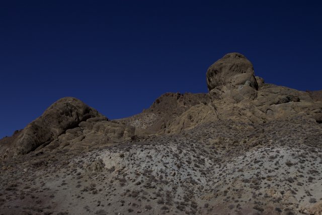 Towering Rocks in the Vast Desert Plateau
