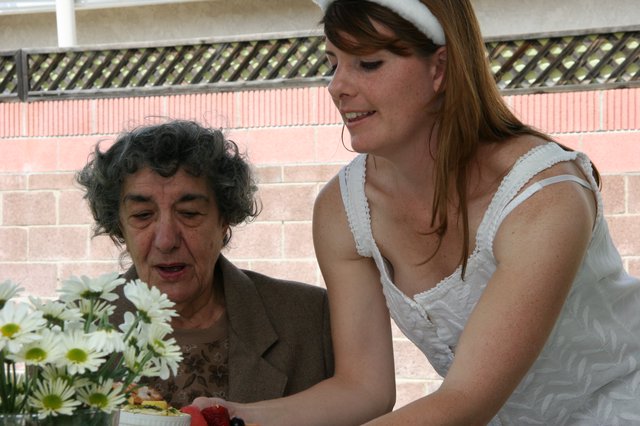 Grandmother and Bride Sharing a Celebratory Cake Moment