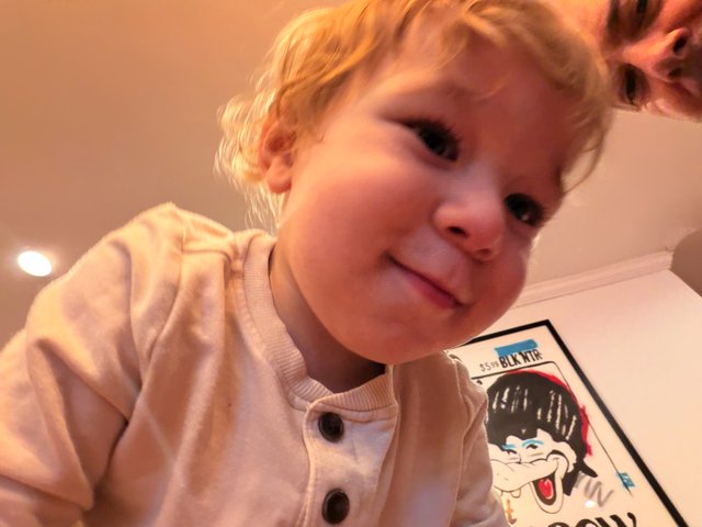 Young Child in Cozy Pink Outfit at Home