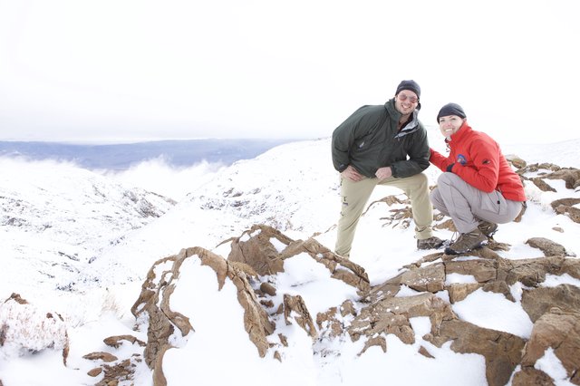 Two Hikers Celebrate Summit in Snowy Mountain Wilderness