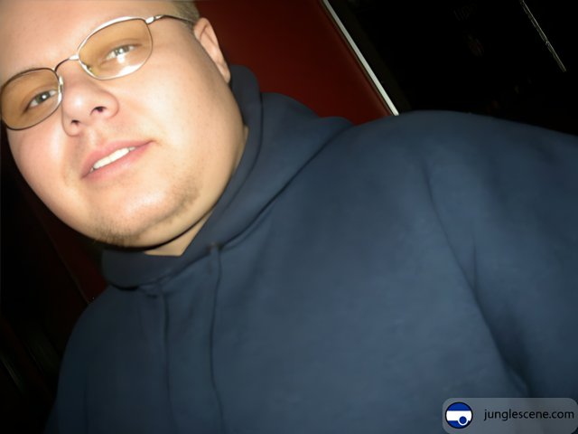 Bryan H in Blue Hoodie and Glasses