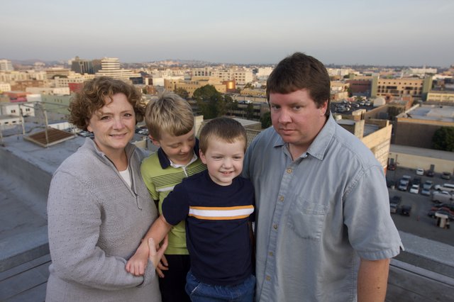 Family Portrait on Urban Rooftop at Dusk