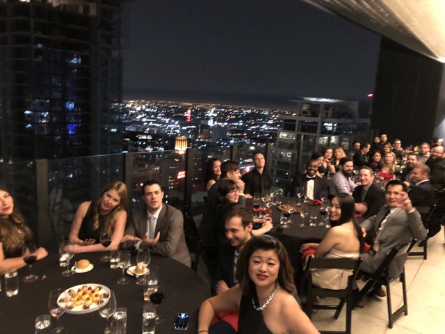 Elegant Rooftop Gala Dinner with City Skyline