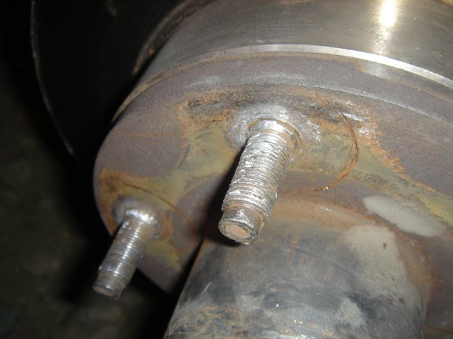 Rusted Brake Rotor with Bolt and Two Screws