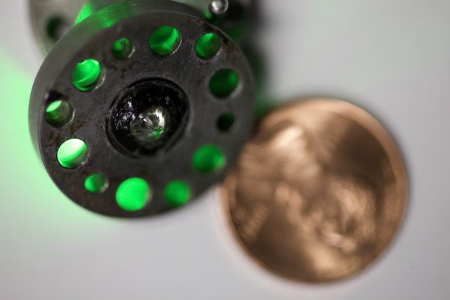 Close Up of a Coin and Green Light