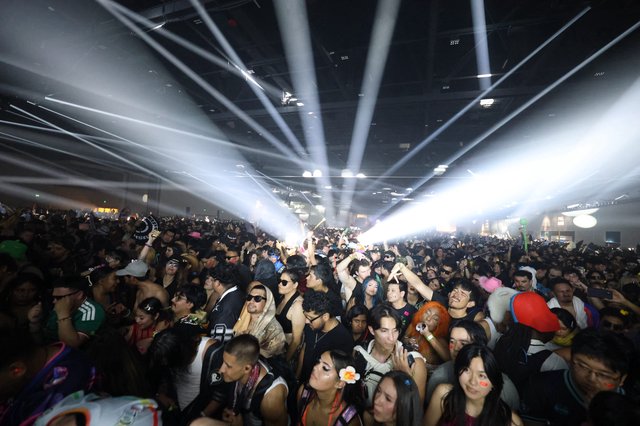 Massive EDM Crowd Bathed in Laser Light Show
