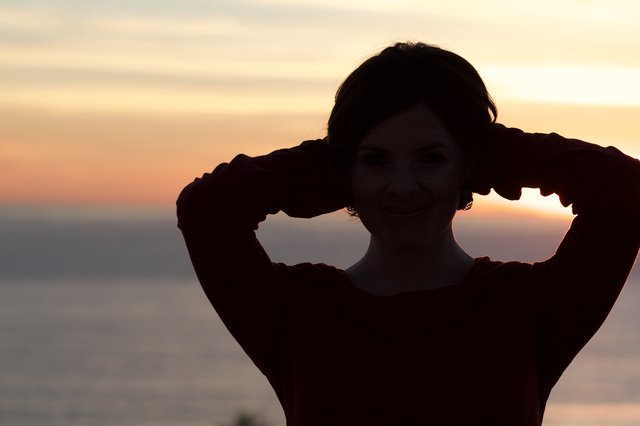 Silhouette of a Smiling Woman at Golden Sunset