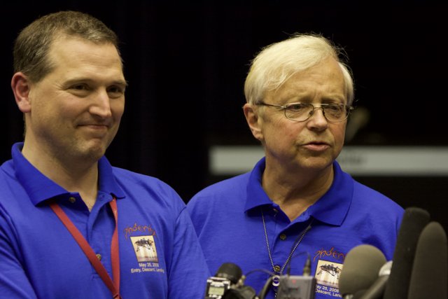 Two Men in Blue Shirts and Glasses at Phoenix Post-Interview