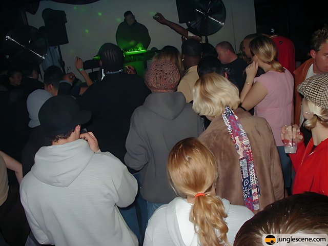 Party-goers dance the night away to the beat of DJ