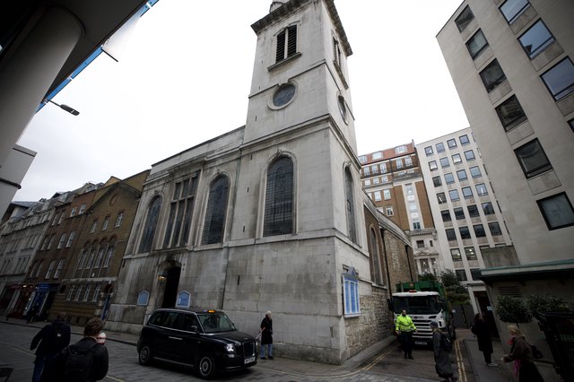 Historic Church Tower Among Modern London Buildings