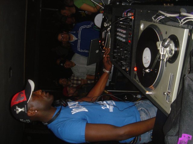 Blue-Shirted DJ at the Club