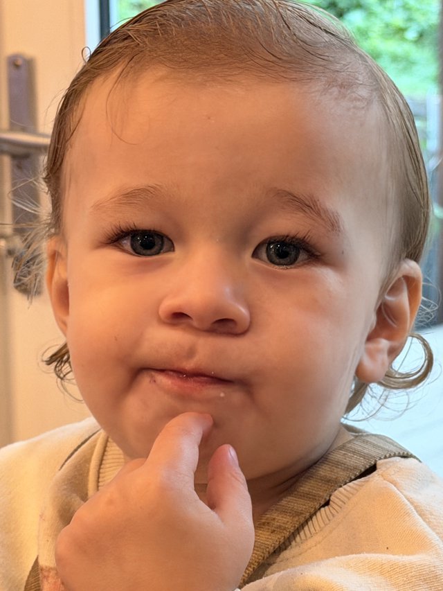 Innocent Blue-Eyed Child in Gentle Contemplation