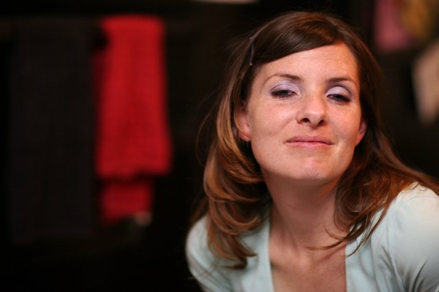 Contemplative Woman in Soft Indoor Light