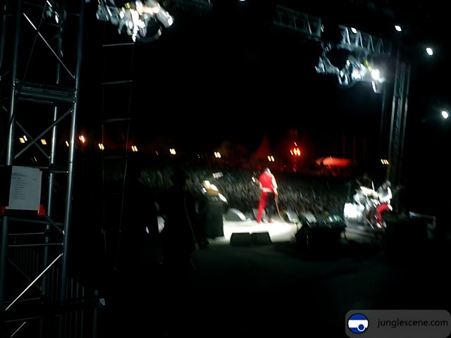Man in Red on Concert Stage