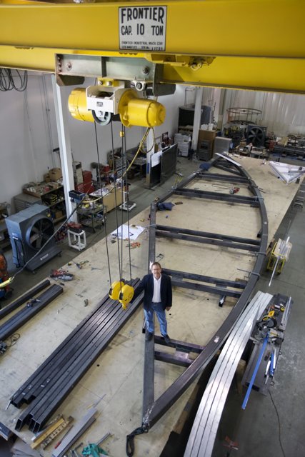 Man in Factory Operating Crane