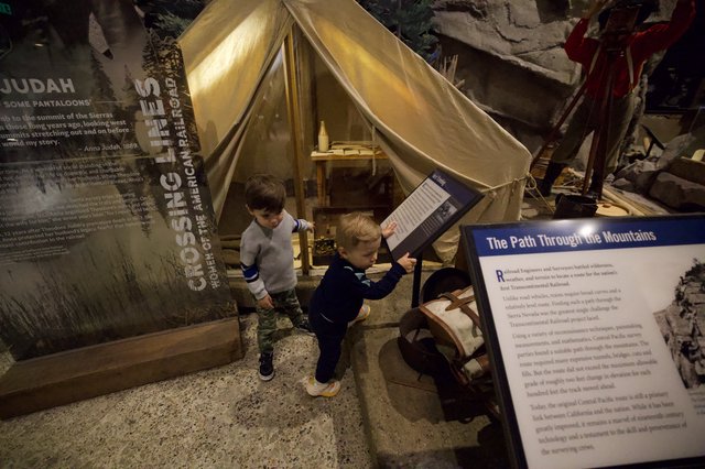 Children Exploring Railroad History Museum Exhibit