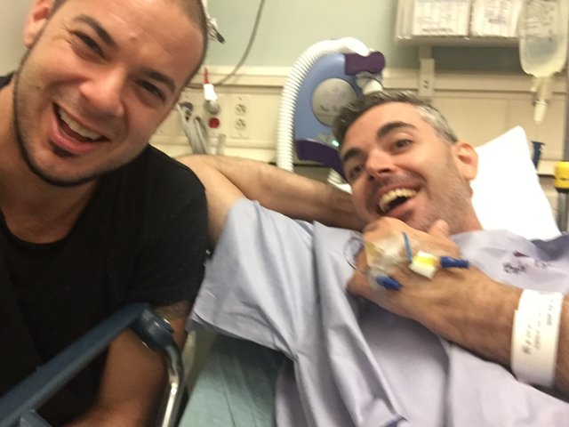 Two Men Smiling in Hospital Beds