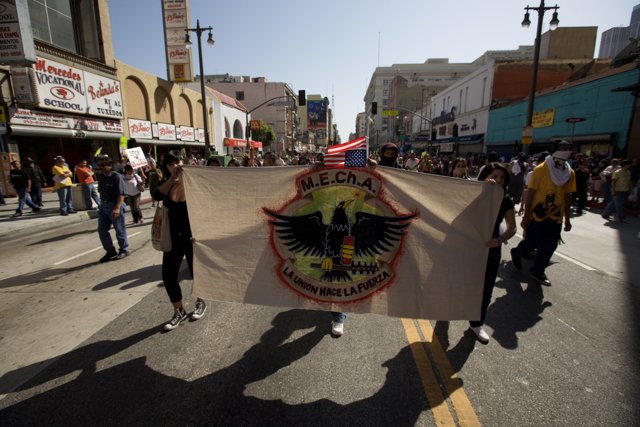 Mayday Rally Participants March with a Bold Banner