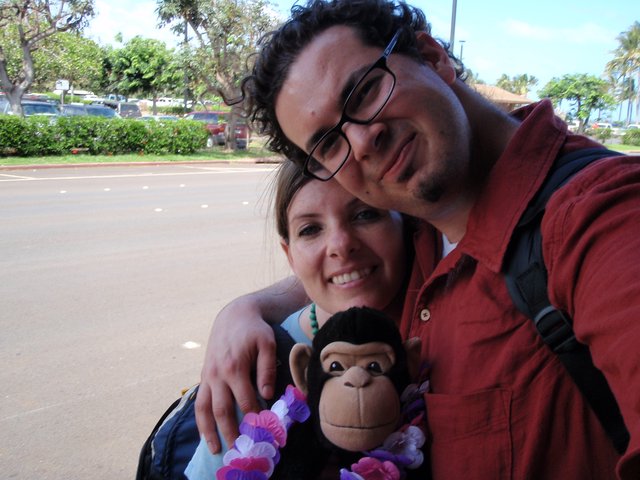 Couple with Monkey Toy at Hawaiian Parking Lot