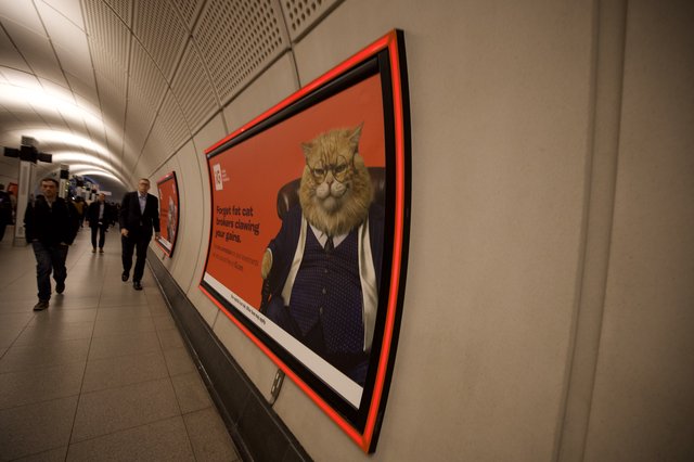 Surreal Cat-Headed Businessman Advertisement in London Underground