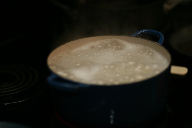 Boiling Cup of Coffee on a Stove