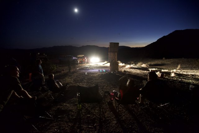 Nighttime Gathering Around the Lunar Flame