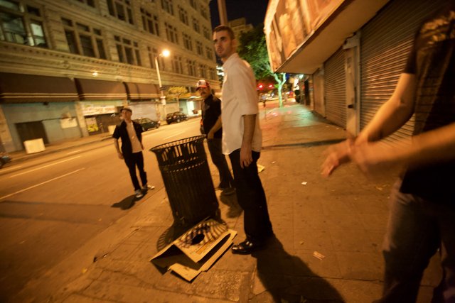 Man and Trash Can on Urban Street