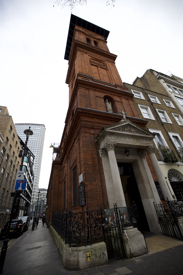 Historic Red Brick Church Tower Rising Above London Street