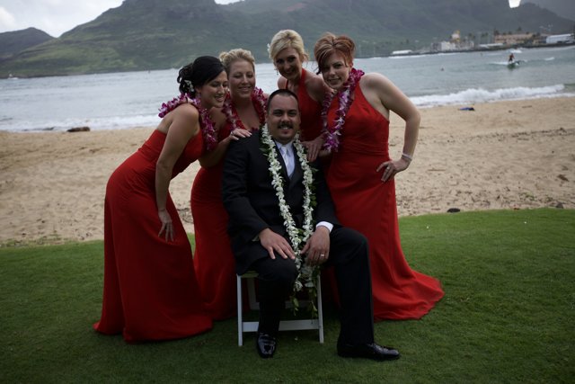 Red Suited Man and Four Women Strike a Pose