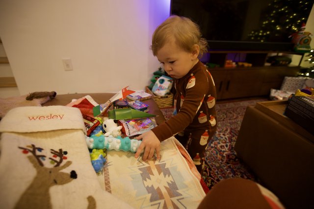 Toddler Opening Christmas Presents at Home