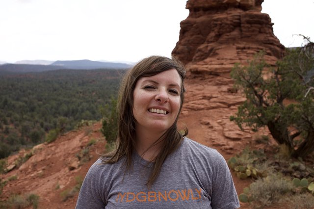 Smiling Hiker Atop Sedona Red Rock Formation