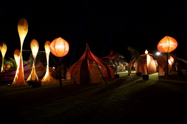 Glowing Tents under the Night Sky