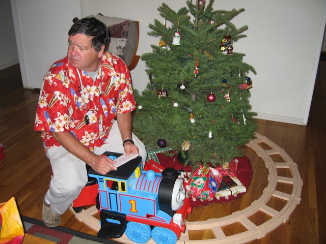 Dad Sets Up Thomas the Tank Engine Christmas Morning