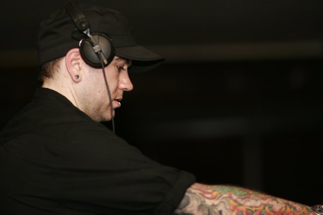 Tattooed Man with Headphones