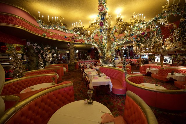 Lavish Christmas Decorated Restaurant Interior with Ornate Chandeliers