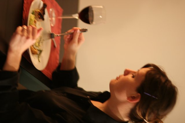 Elegant Woman Dining Alone with Red Wine