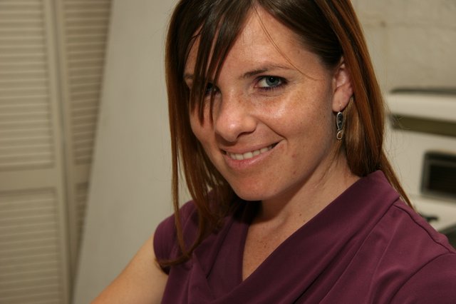 Warm Smile Portrait of Woman in Purple Top