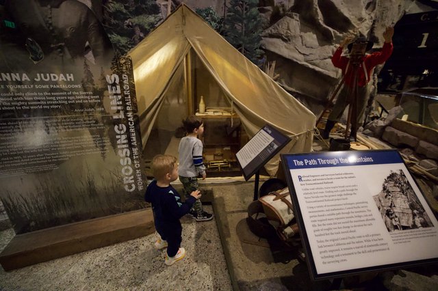 Children Exploring Historical Mountain Crossing Tent Exhibit