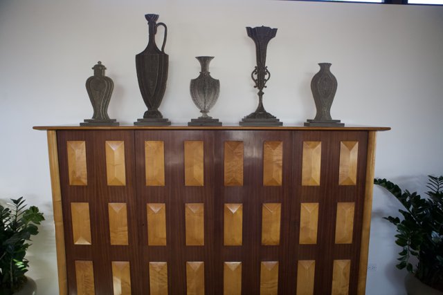 The Wooden Cabinet with Four Vases