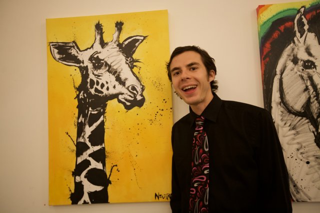 Man in Formal Wear Admires Giraffe Painting